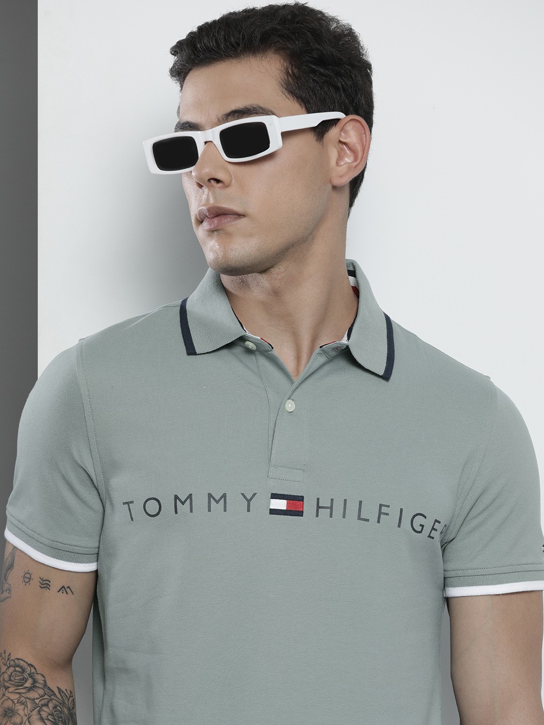 

Tommy Hilfiger Men Green Brand Logo Printed Polo Collar Slim Fit T-shirt