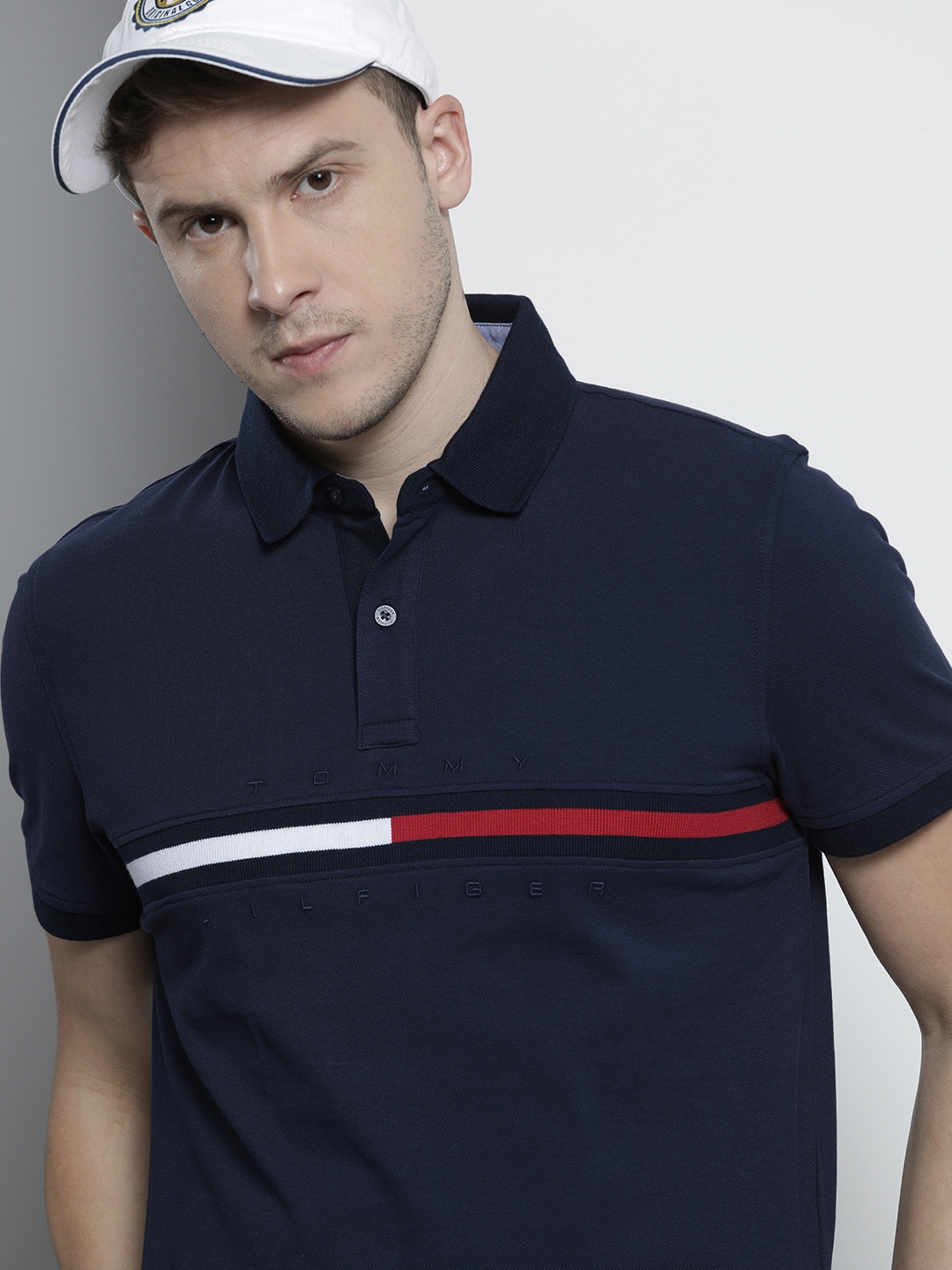 

Tommy Hilfiger Men Navy Blue & White Colourblocked Polo Collar T-shirt