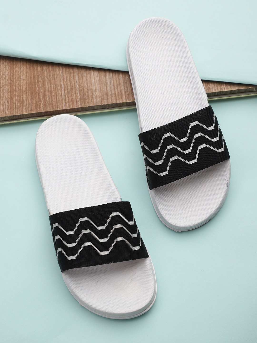 

Pampy Angel Men White & Black Printed Rubber Sliders