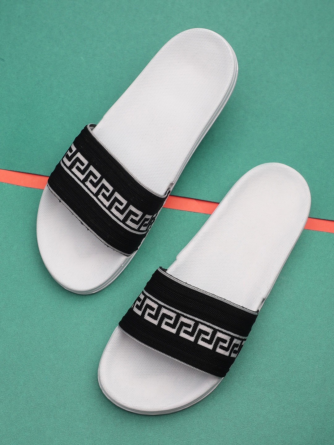 

Pampy Angel Men White & Black Printed Rubber Sliders