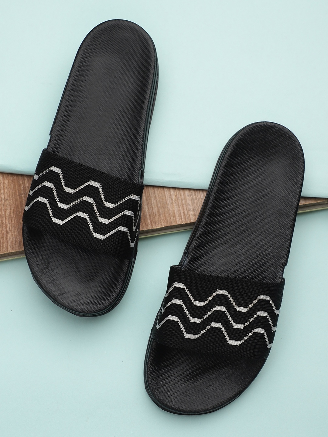 

Pampy Angel Men Black & White Printed Rubber Sliders