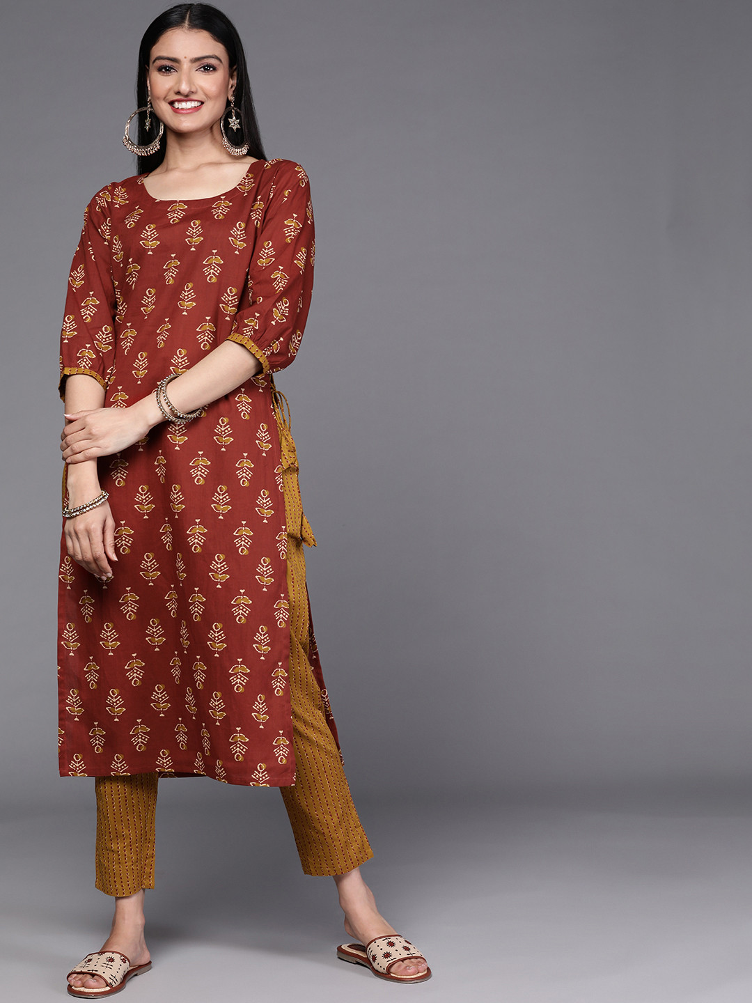 

Libas Women Floral Motifs Printed Pure Cotton Kurta with Trousers, Rust