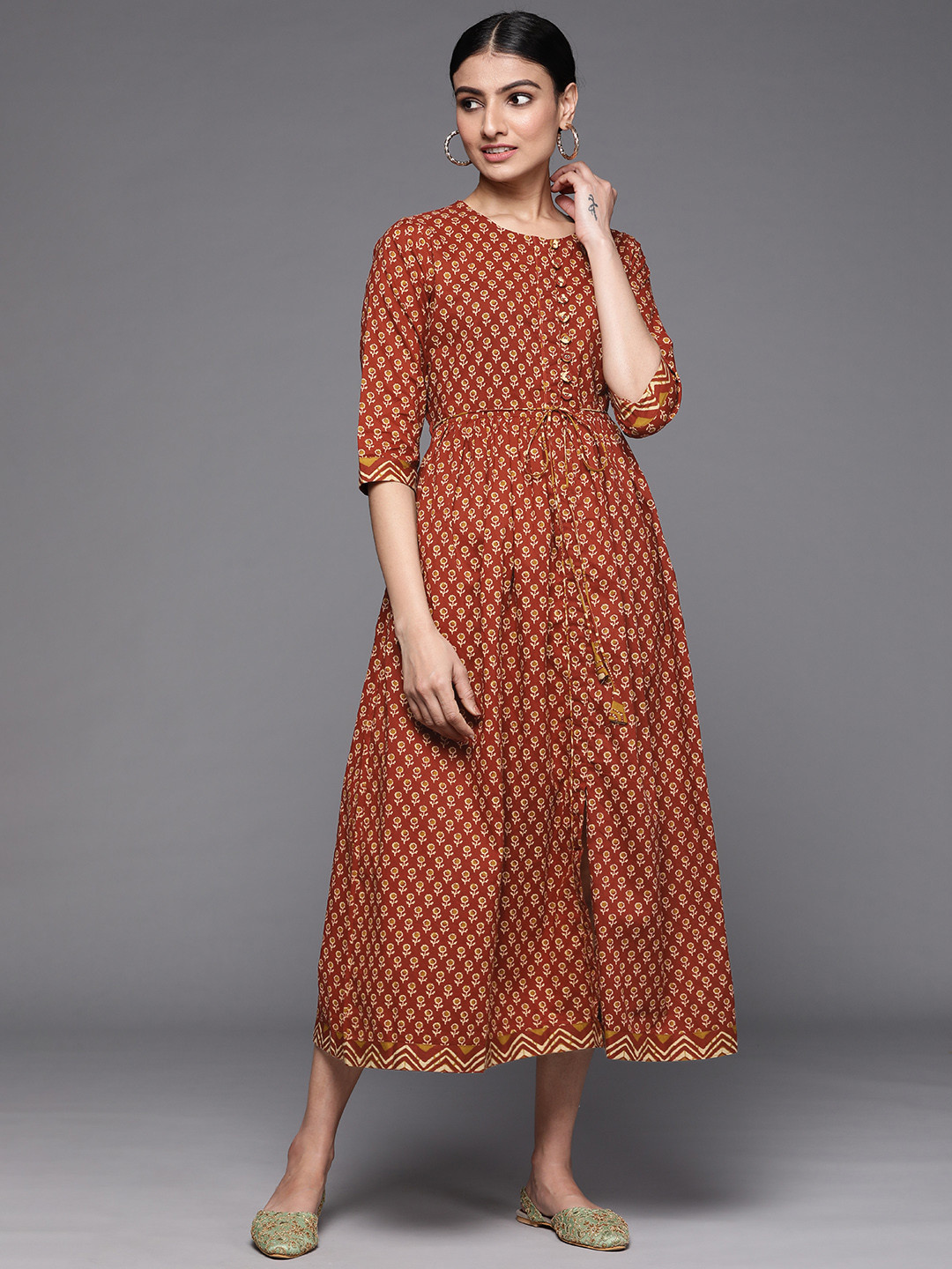 

Libas Rust Red & Mustard Floral Motifs Printed A-Line Midi Dress With Tie-Up Detail