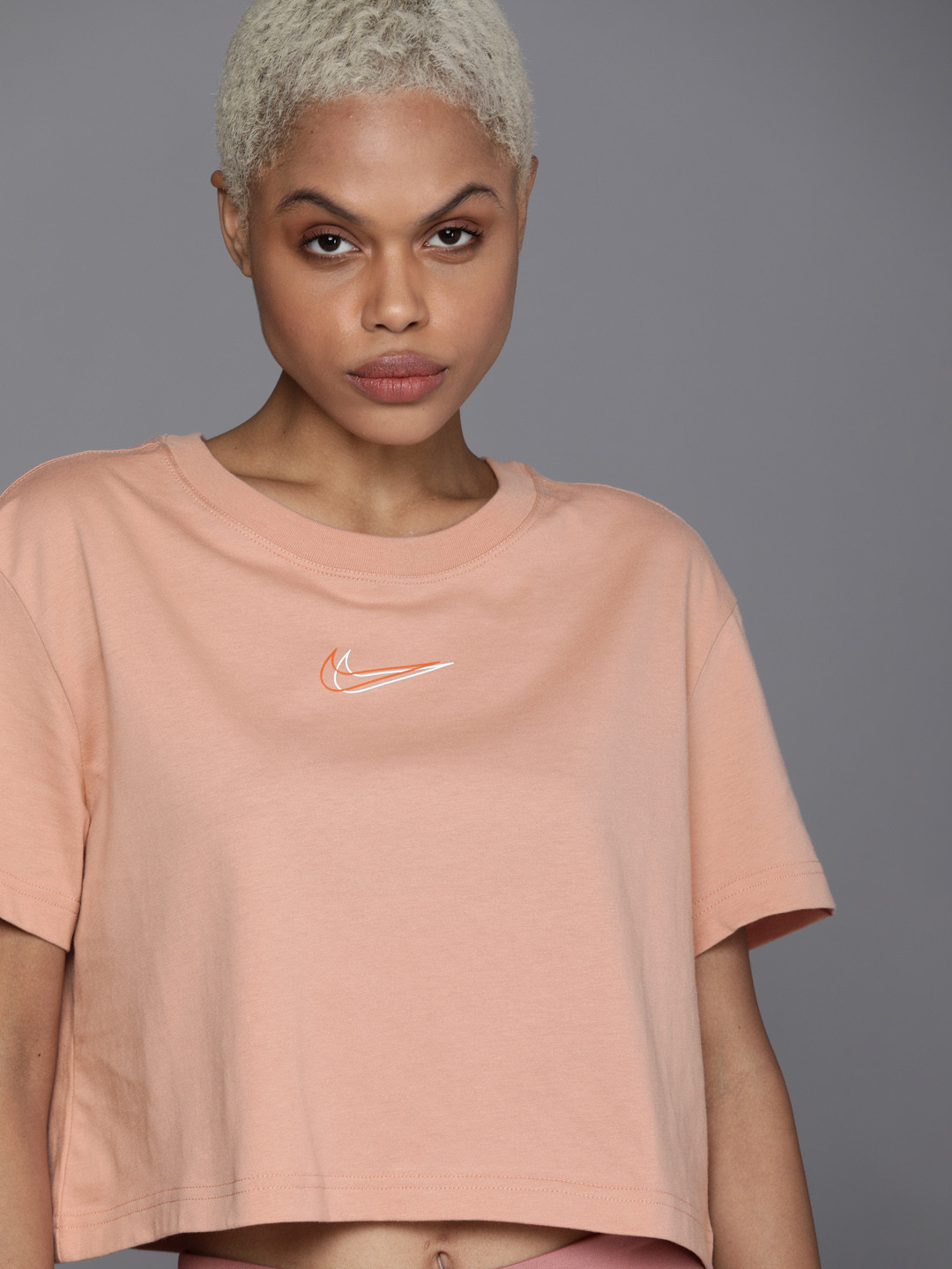 

Nike Peach-Coloured Crop Top with Printed Details