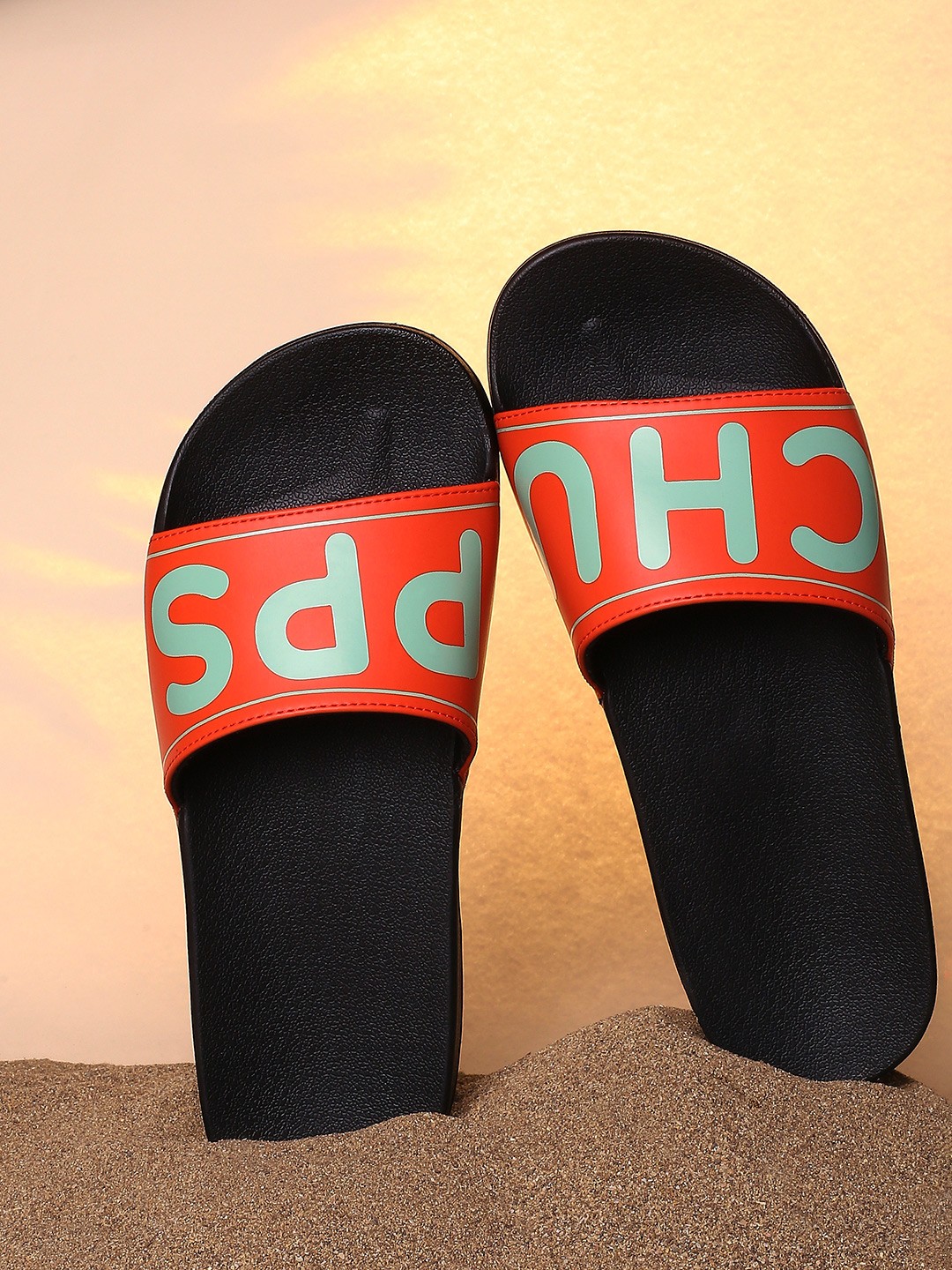 

CHUPPS Men Orange & Black Printed Rubber Sustainable Sliders