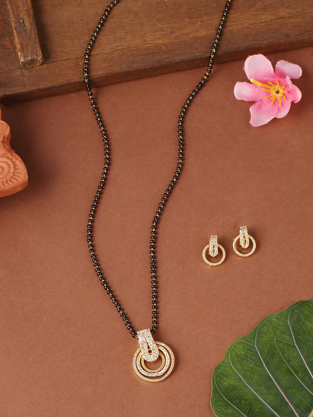 

VIRAASI Gold-Plated White AD Studded & Black Beaded Mangalsutra Set