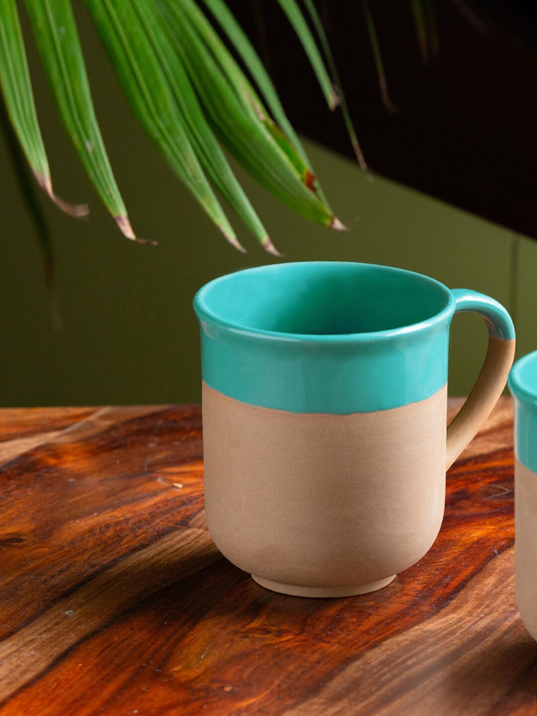 

ExclusiveLane Turquoise Blue & Beige Solid Ceramic Matte Coffee Mugs (360 ML)