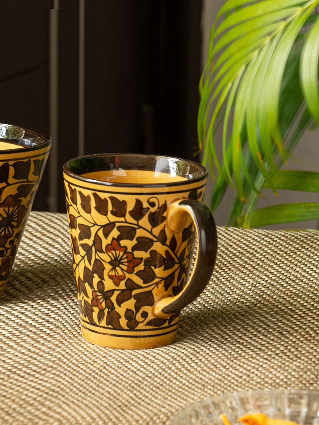 

ExclusiveLane Brown & Yellow Mughal Floral Hand Painted Ceramic Glossy Coffee Mug (240 ML)