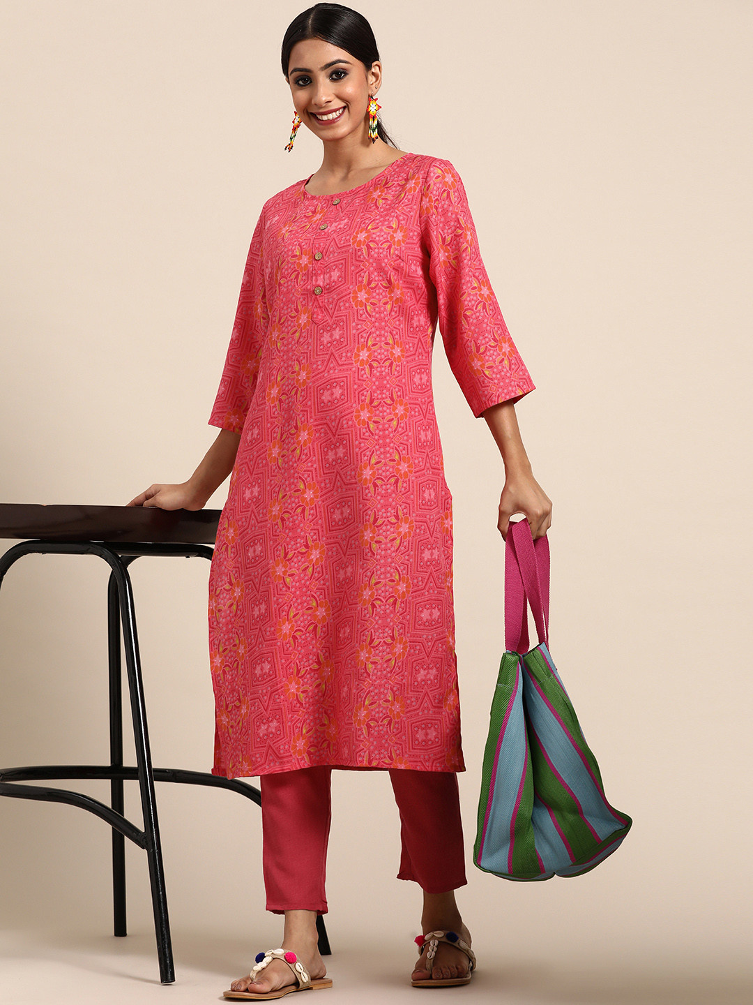

Sangria Women Coral Pink & Orange Ethnic Motifs Printed Kurta with Trousers