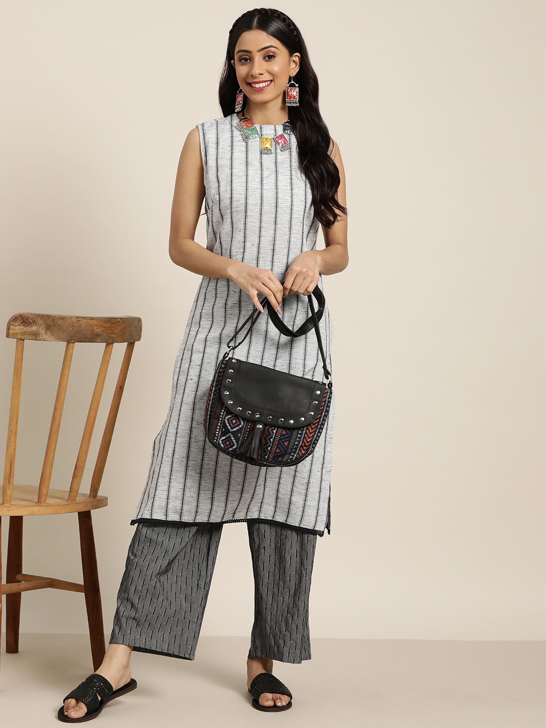 

Sangria Women Grey Striped Straight Kurta with Palazzos