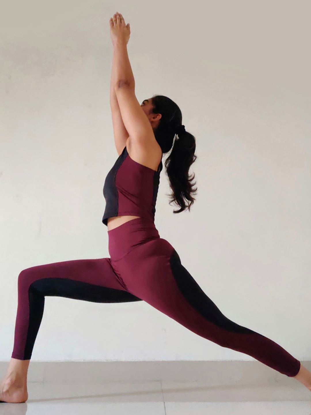 

KICA Women Burgundy & Black Colourblocked High-Rise Tracksuit