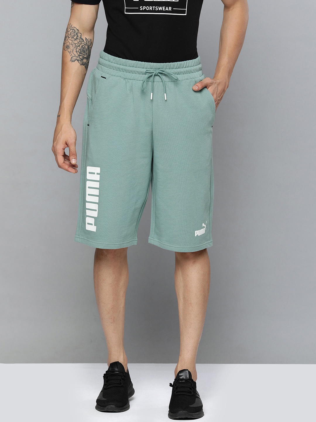 

Puma Men Turquoise Blue Printed Power Relaxed Fit Sports Shorts