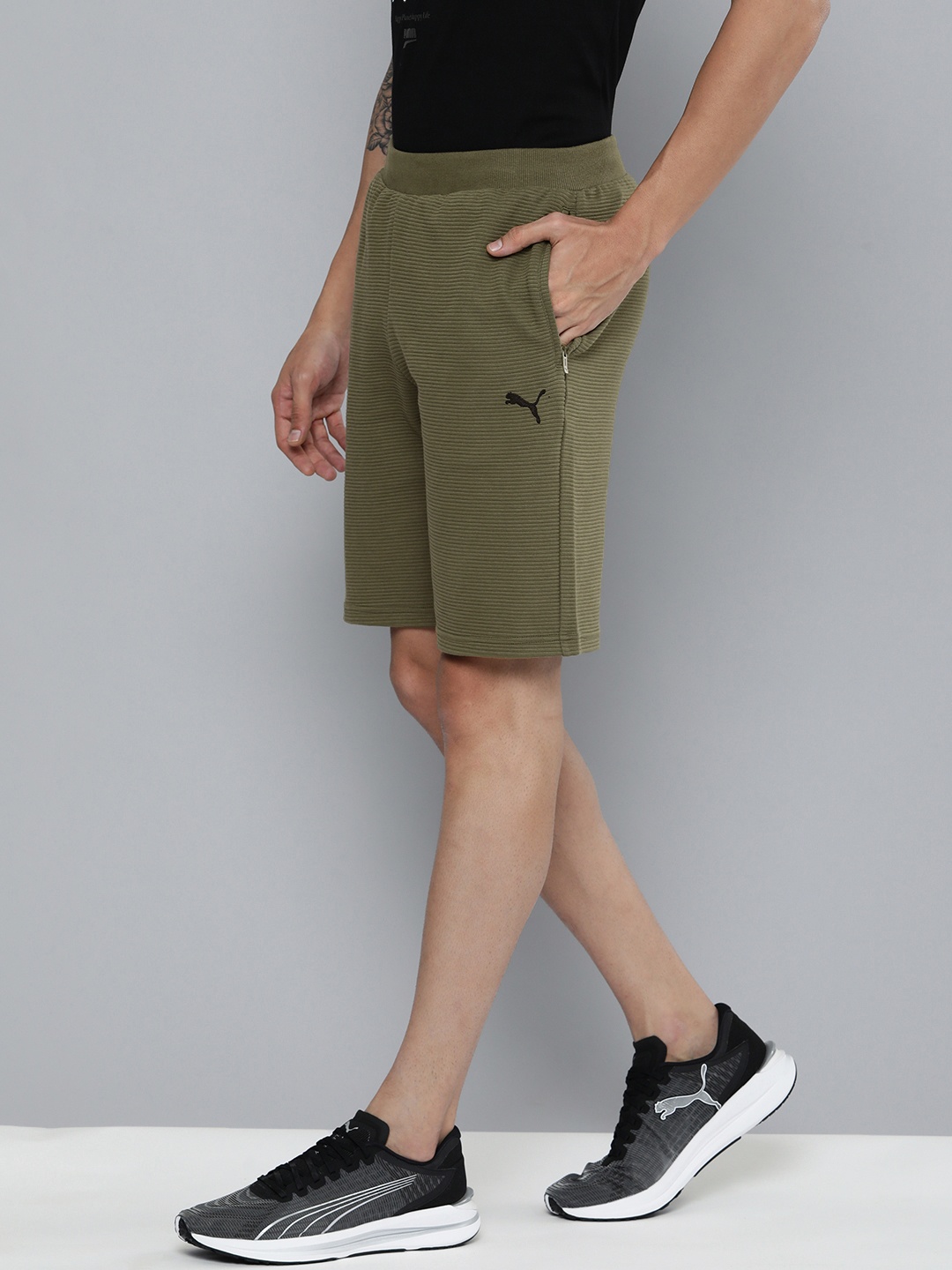 

Puma Men Olive Green Self Design Striped Regular Shorts