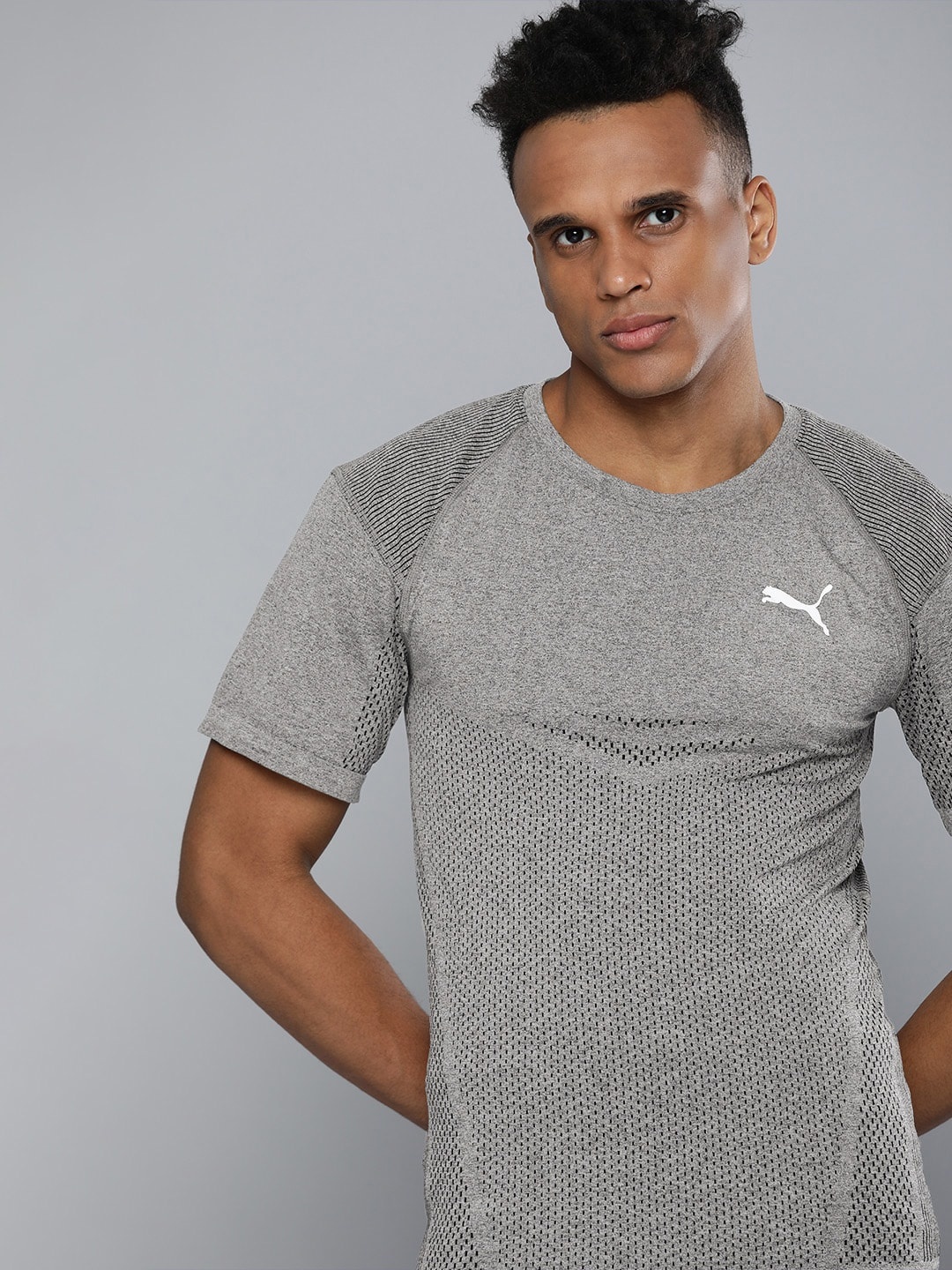 

Puma Men Grey Melange Self Design EVOKNIT Raglan Sleeves Slim Fit Training T-shirt