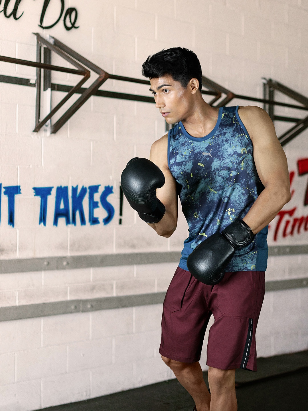 

one8 x PUMA Men Blue Printed Slim Fit Sleevless Training or Gym T-shirt