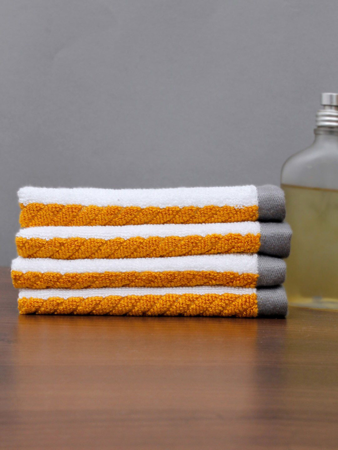 

AVI Living Pack Of 4 White & Yellow Face Towels
