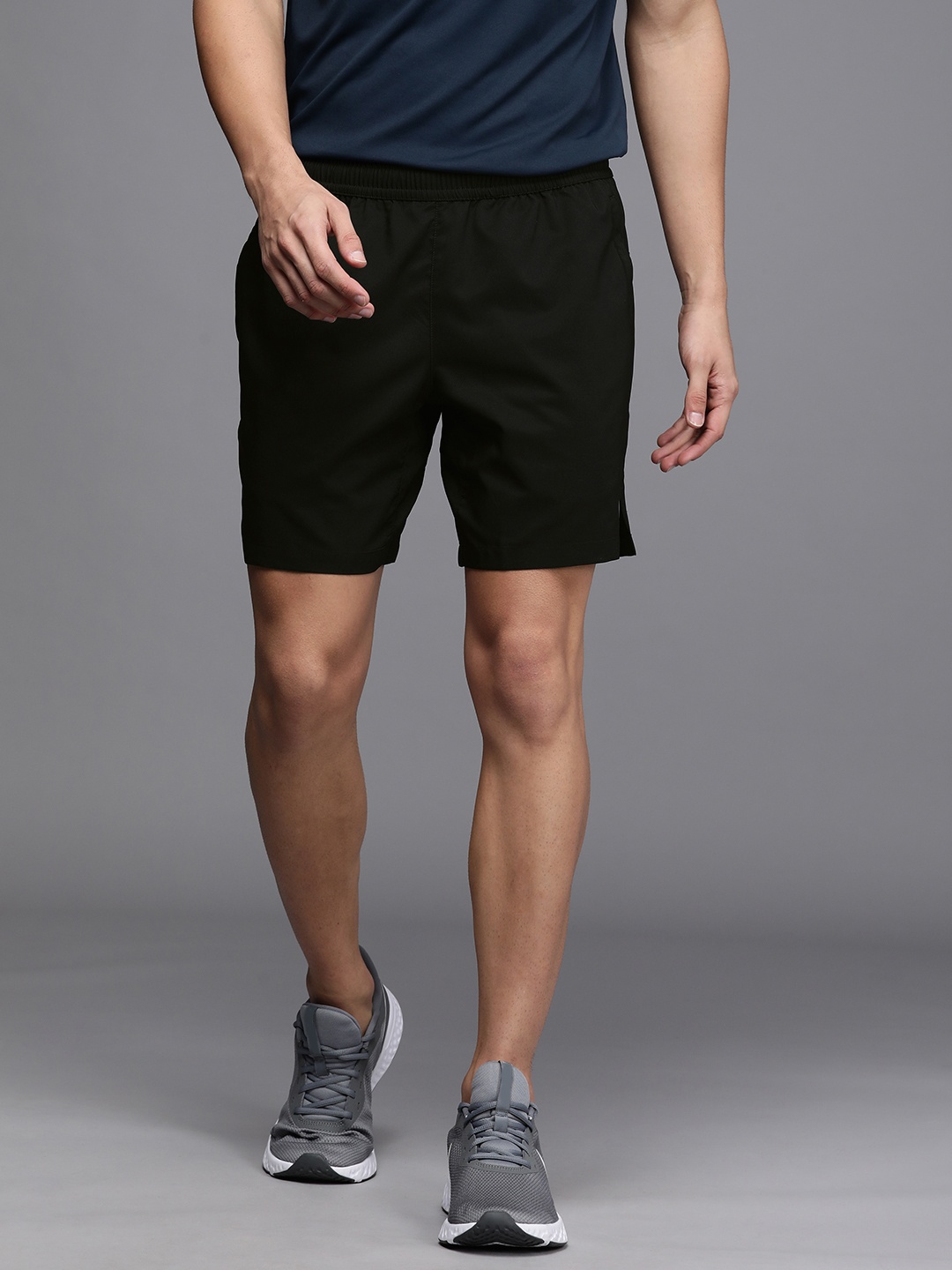 

ASICS Men Black Solid Mid Rise Above Knee Running Shorts