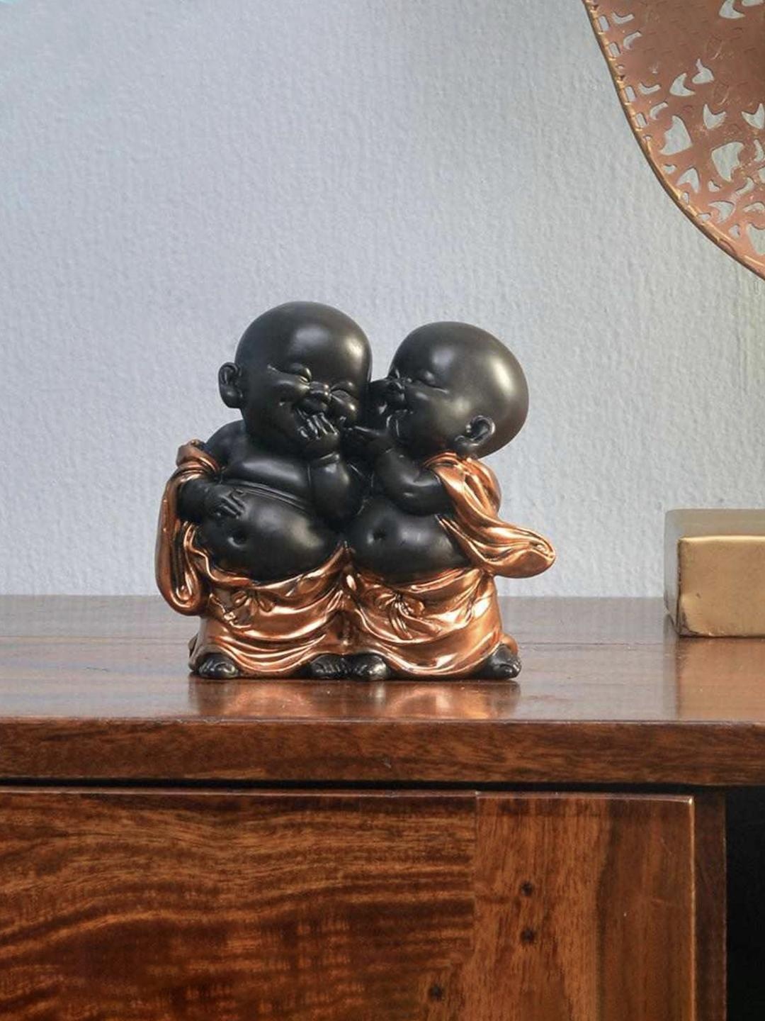 

Athome by Nilkamal Black & Copper-Toned Baby Monks Whispering Showpiece