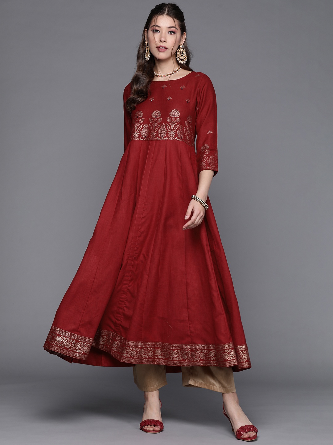 

PINKSKY Women Red Ethnic Motifs Printed Panelled Mirror Work Kurta with Palazzos