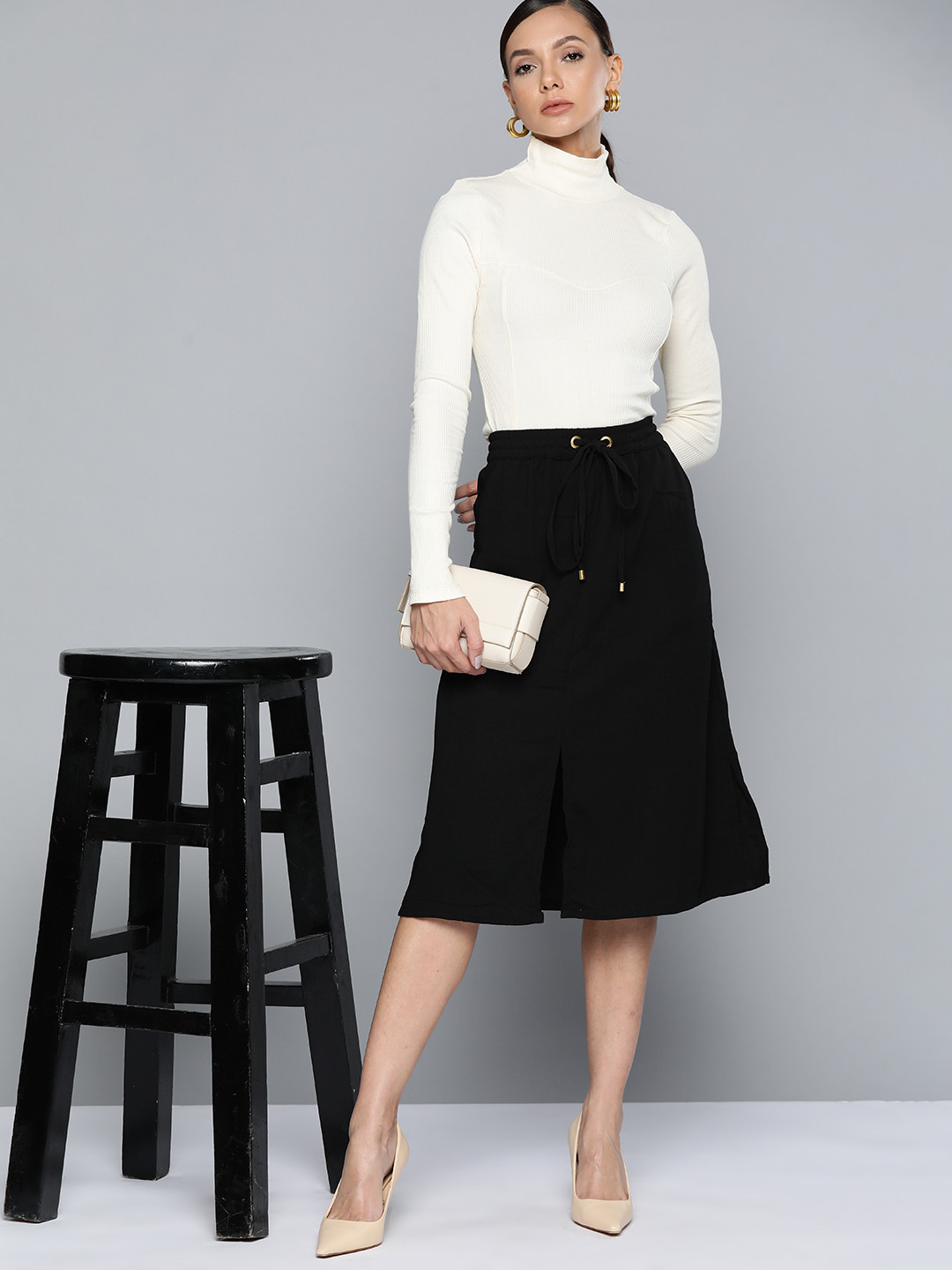 

Chemistry Women Black Solid Front Slit Midi A-Line Skirt