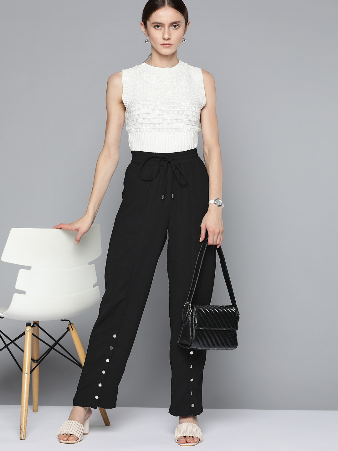 

Chemistry Women Black Solid Button Detail Trousers