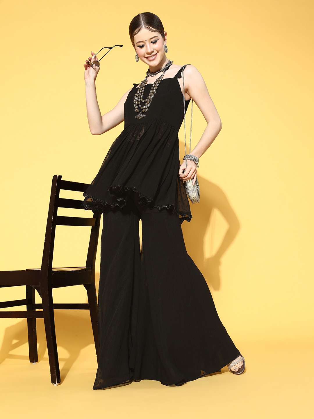 

Inddus Solid Poly-Chiffon Swirling Volume Kurta Set, Black