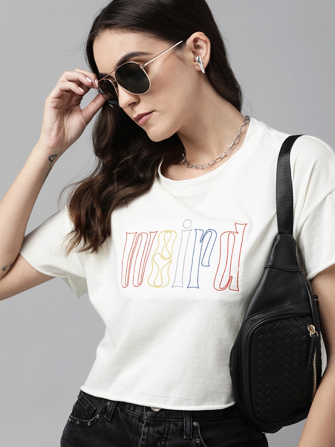 

The Roadster Lifestyle Co Women White Typography Embroidered Pure Cotton Crop T-shirt with Curled Hem