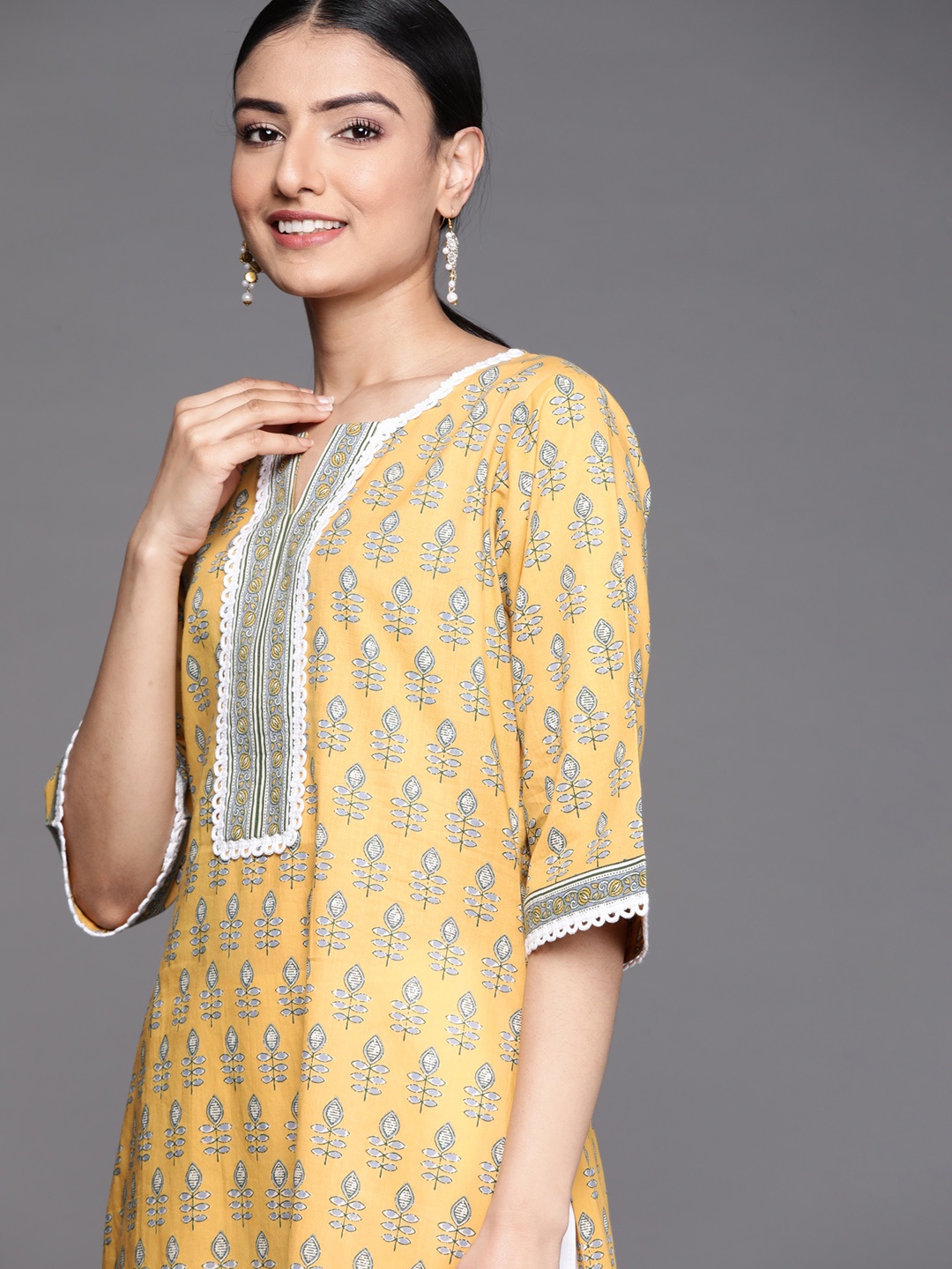 

Libas Women Yellow Floral Printed Flared Sleeves Floral Kurta