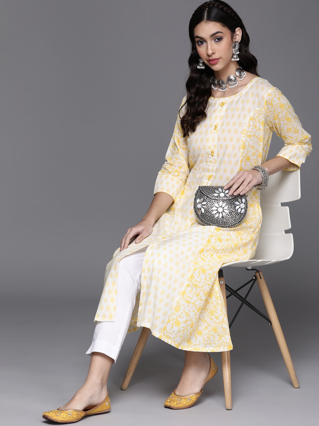 

Libas Women Yellow & White Floral Motifs Printed Cotton A-line Kurta