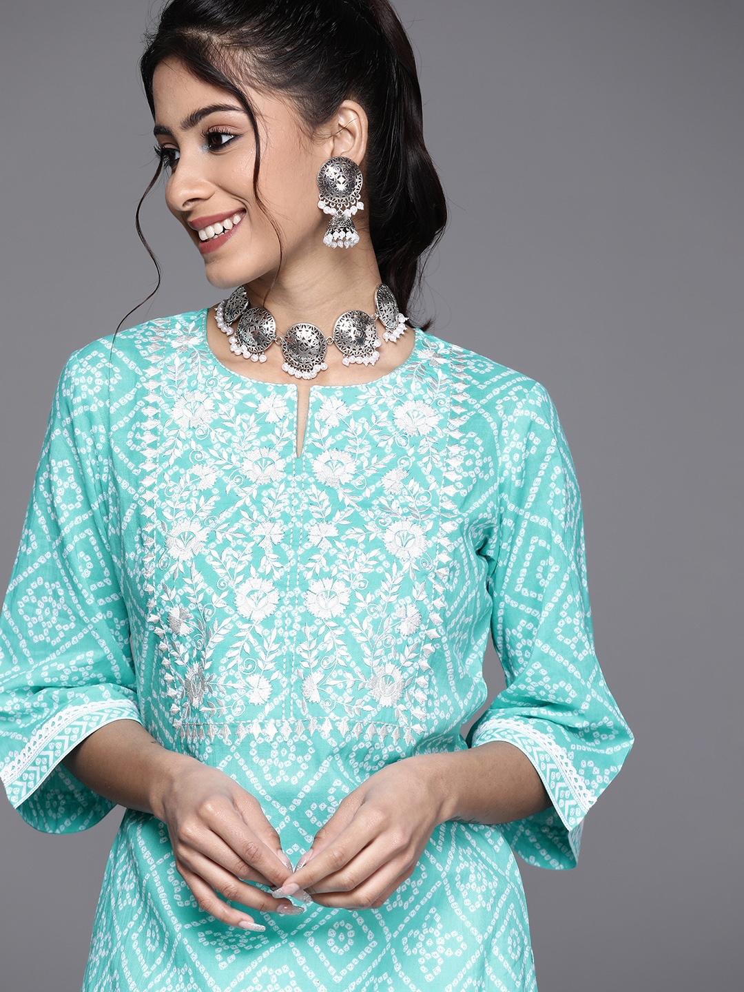 

Libas Women Turquoise Blue Bandhani Print Embroidered Cotton Kurta