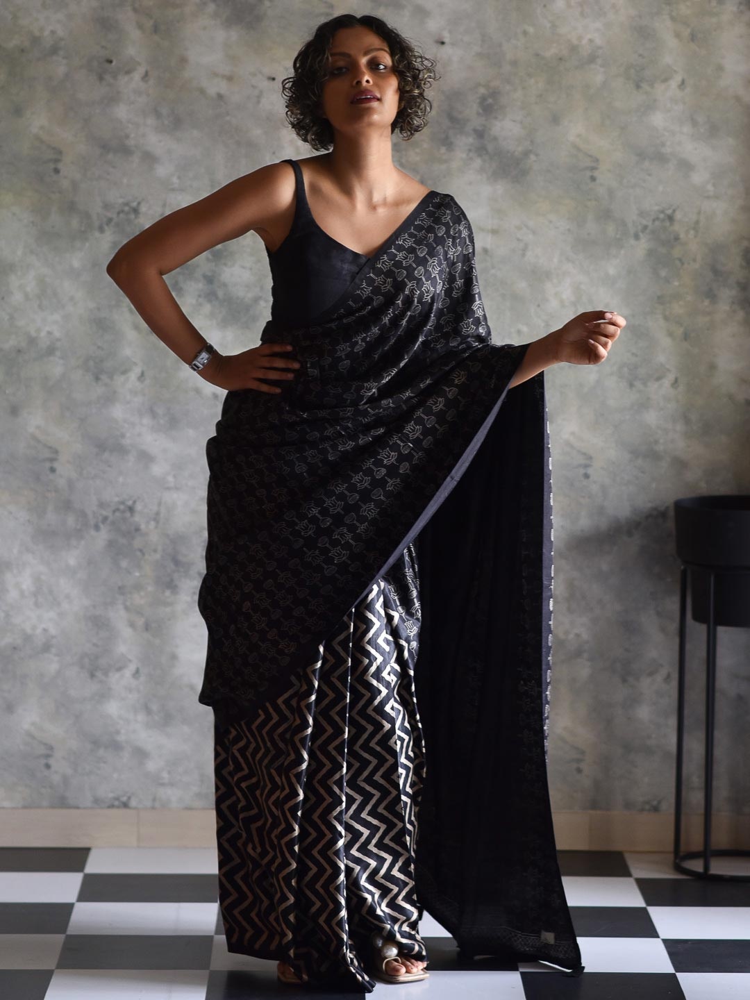 

Suta Black & Beige Floral Saree