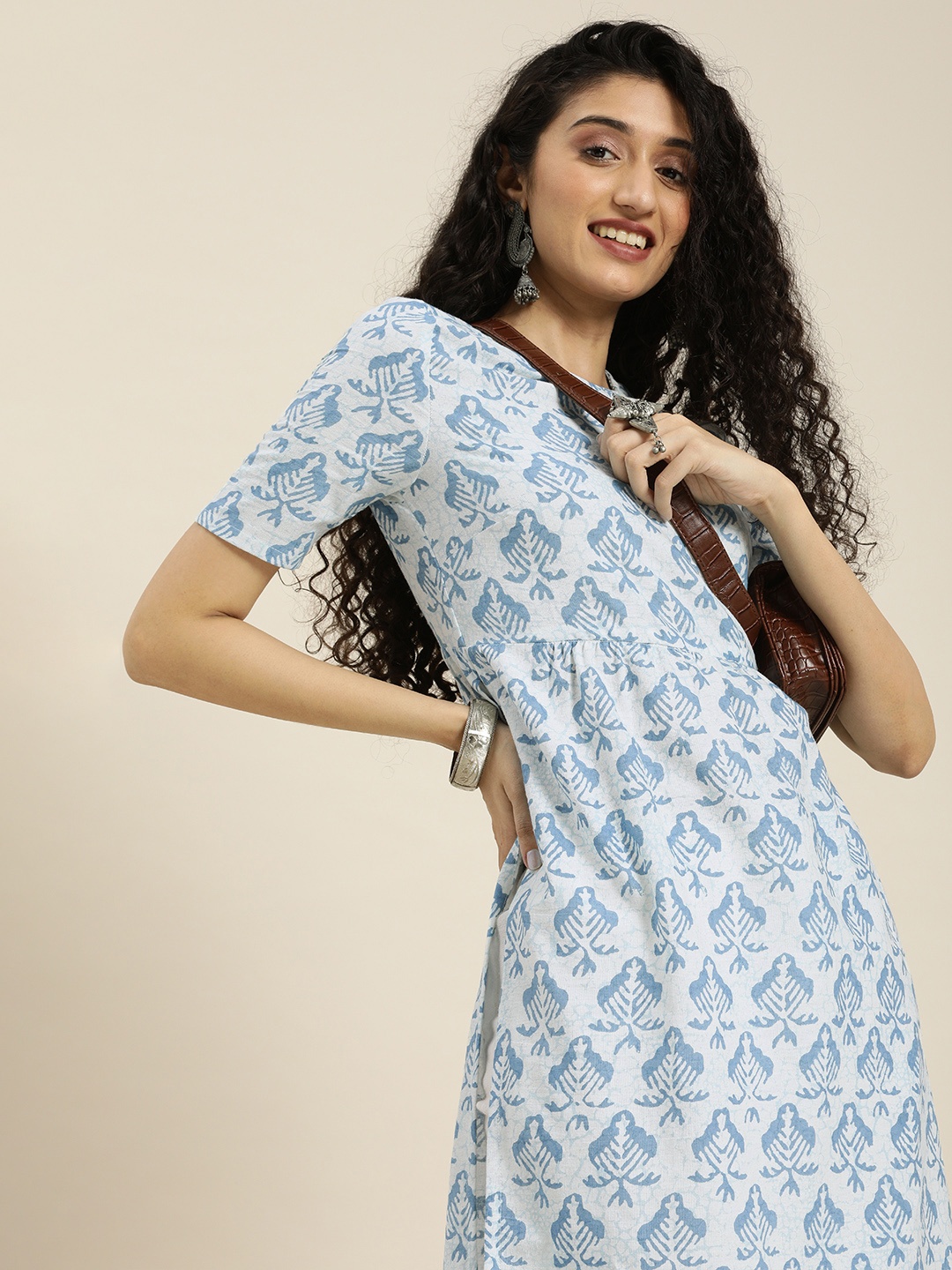 

Taavi Women White & Blue Ethnic Motifs Printed Puff Sleeves Sustainable Kurta