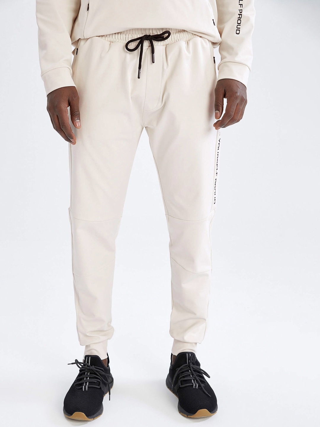 

DeFacto Men Off-White Slim Fit Solid Joggers