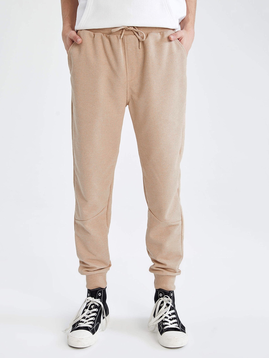 

DeFacto Men Beige Textured Solid Joggers