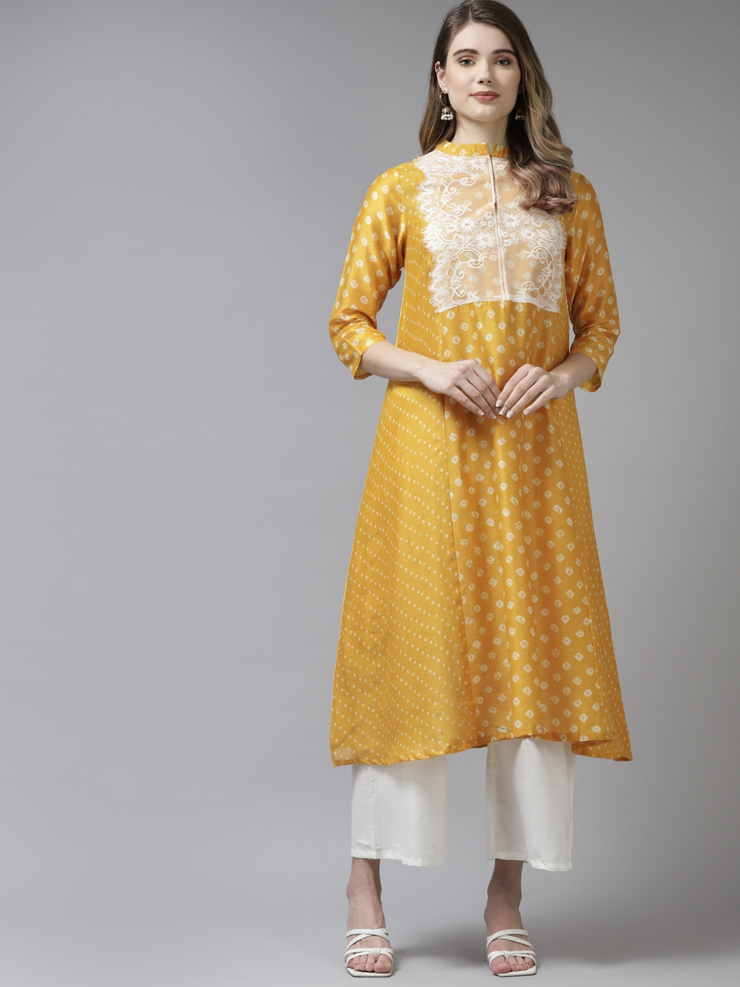 

Bhama Couture Women Yellow Bandhani Printed Kurta with Palazzos