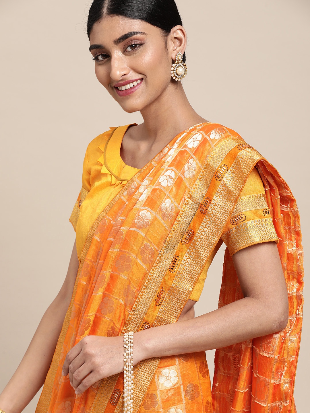 

Satrani Orange & Gold-Toned Floral Woven Design Saree