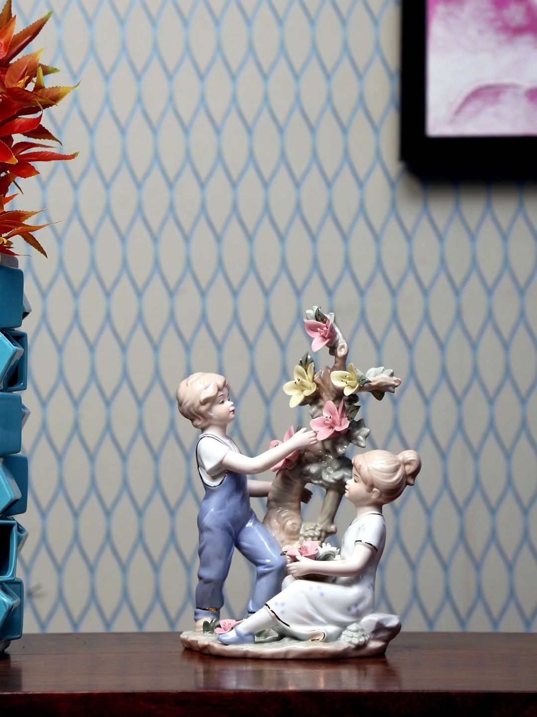 

Athome by Nilkamal Blue Children Plucking FLower Showpiece