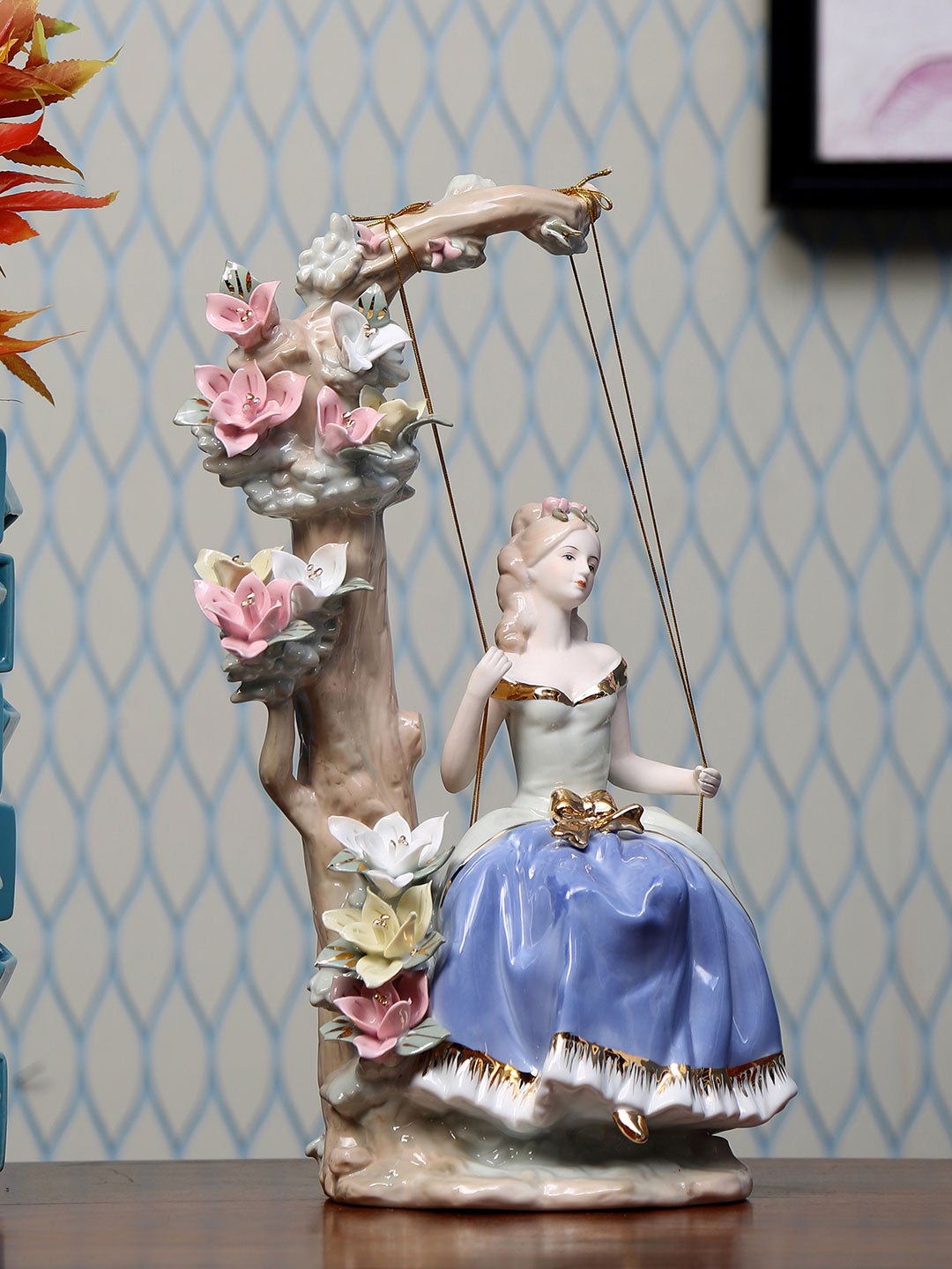 

Athome by Nilkamal Blue Lady On Swing Ceramic Showpiece