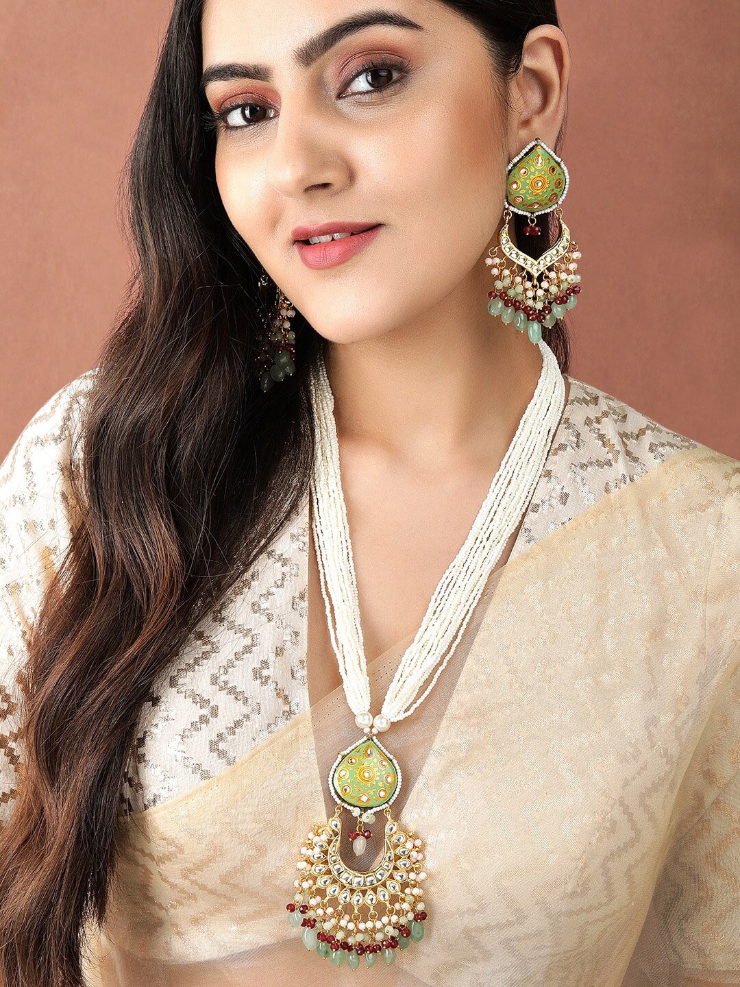 

Rubans Gold Plated Kundan Studded Brown & White Beaded Green Enamaled Choker Set