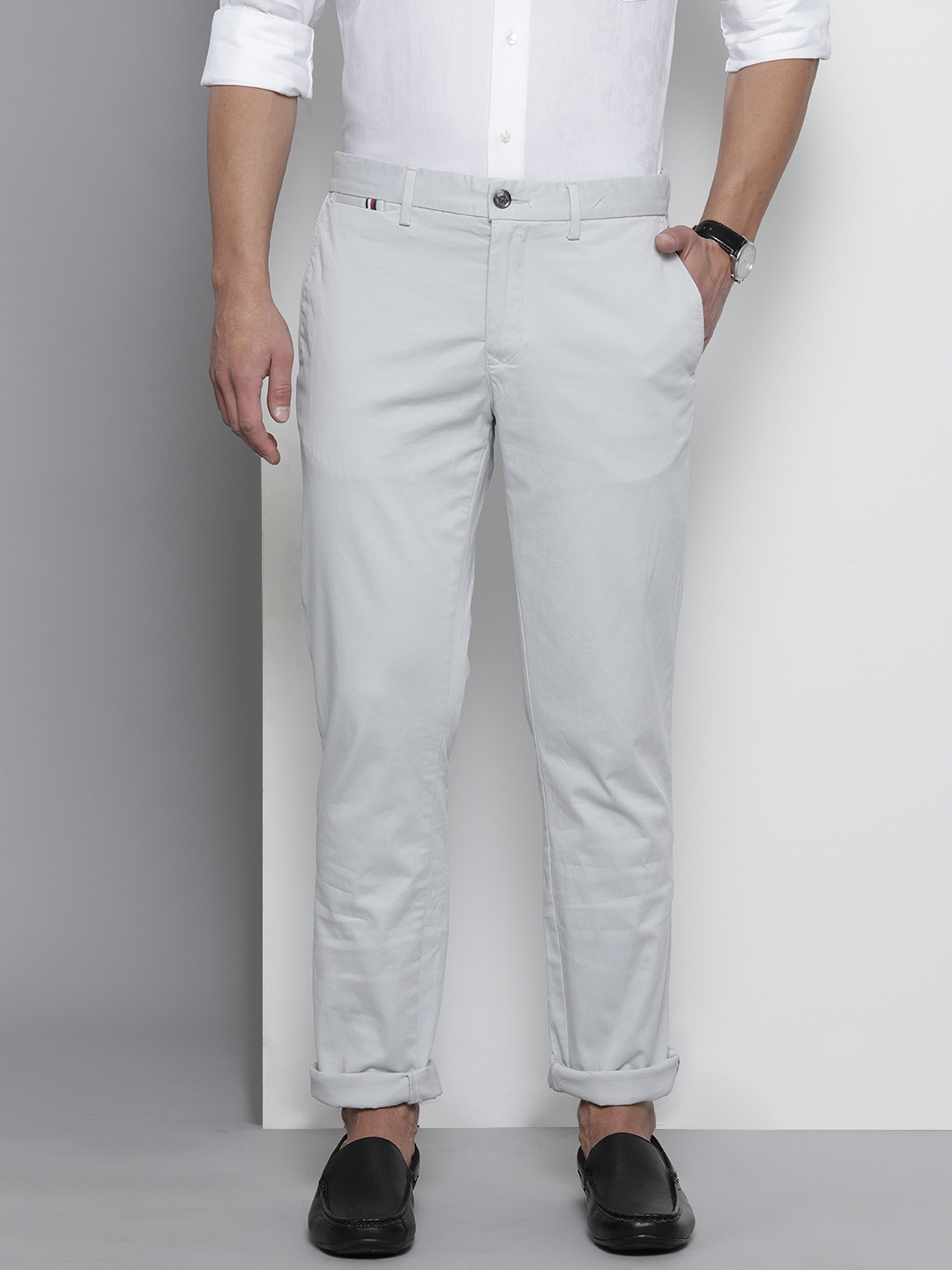 

Tommy Hilfiger Men Cream-Coloured Solid Mid Rise Chinos Trousers