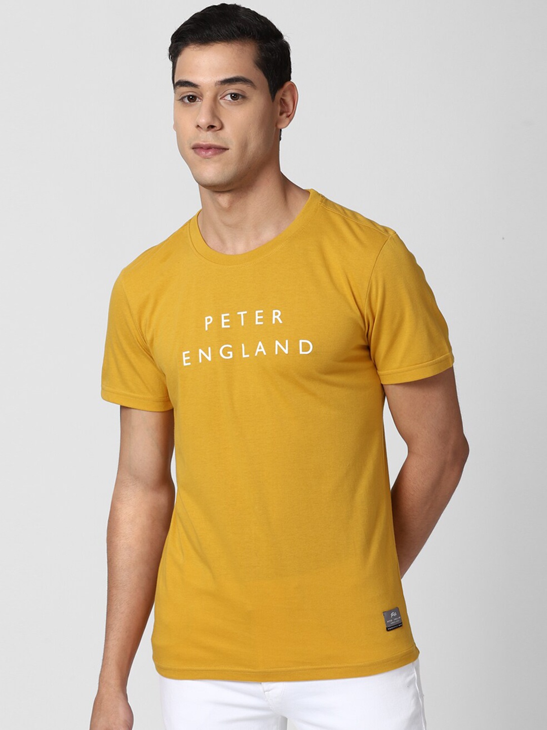 

Peter England Casuals Men Yellow Typography Printed Slim Fit T-shirt