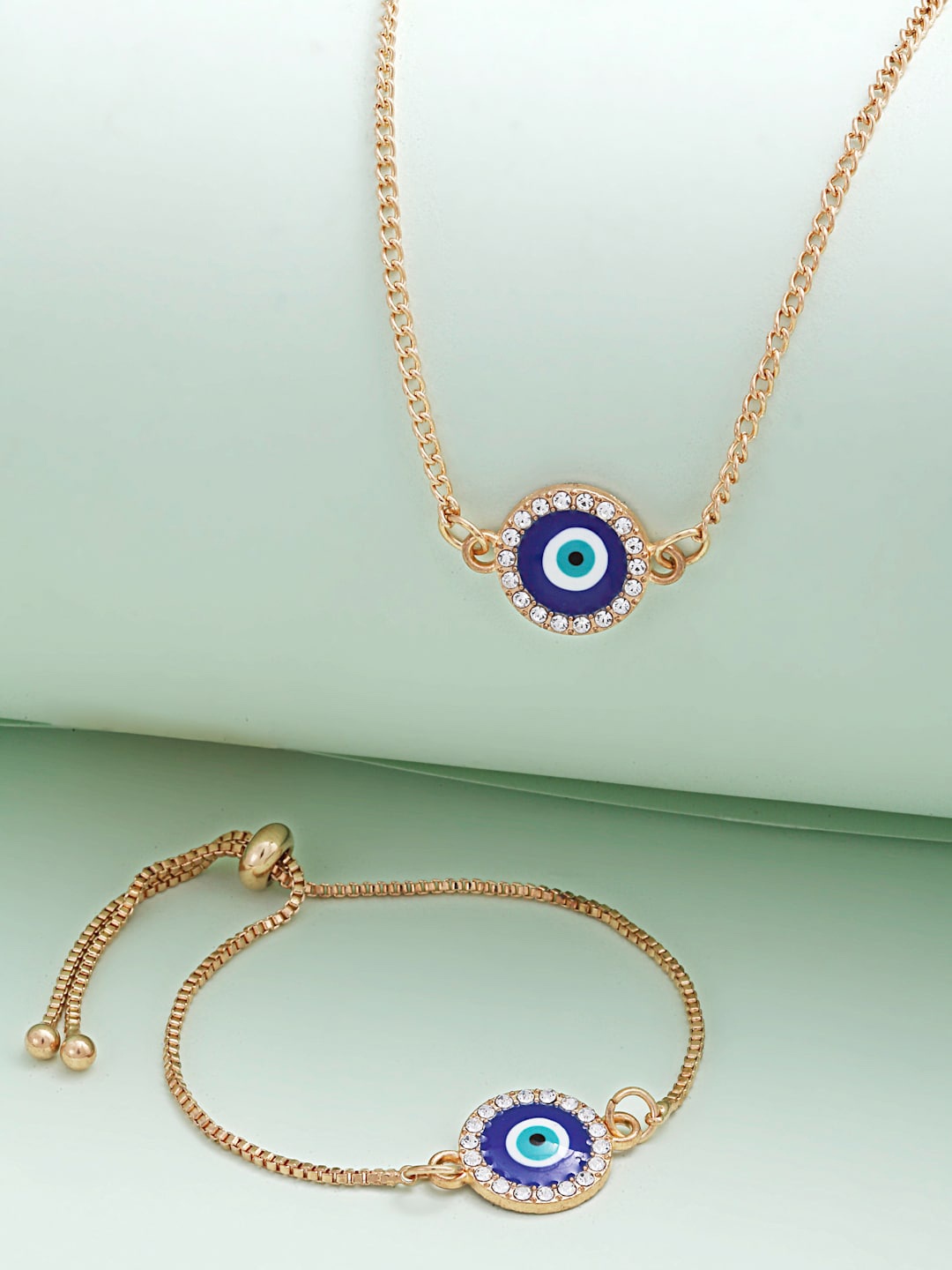 

Ferosh Gold Plated Round Crystal Boundary Evil Eye Necklace With Bracelet Set