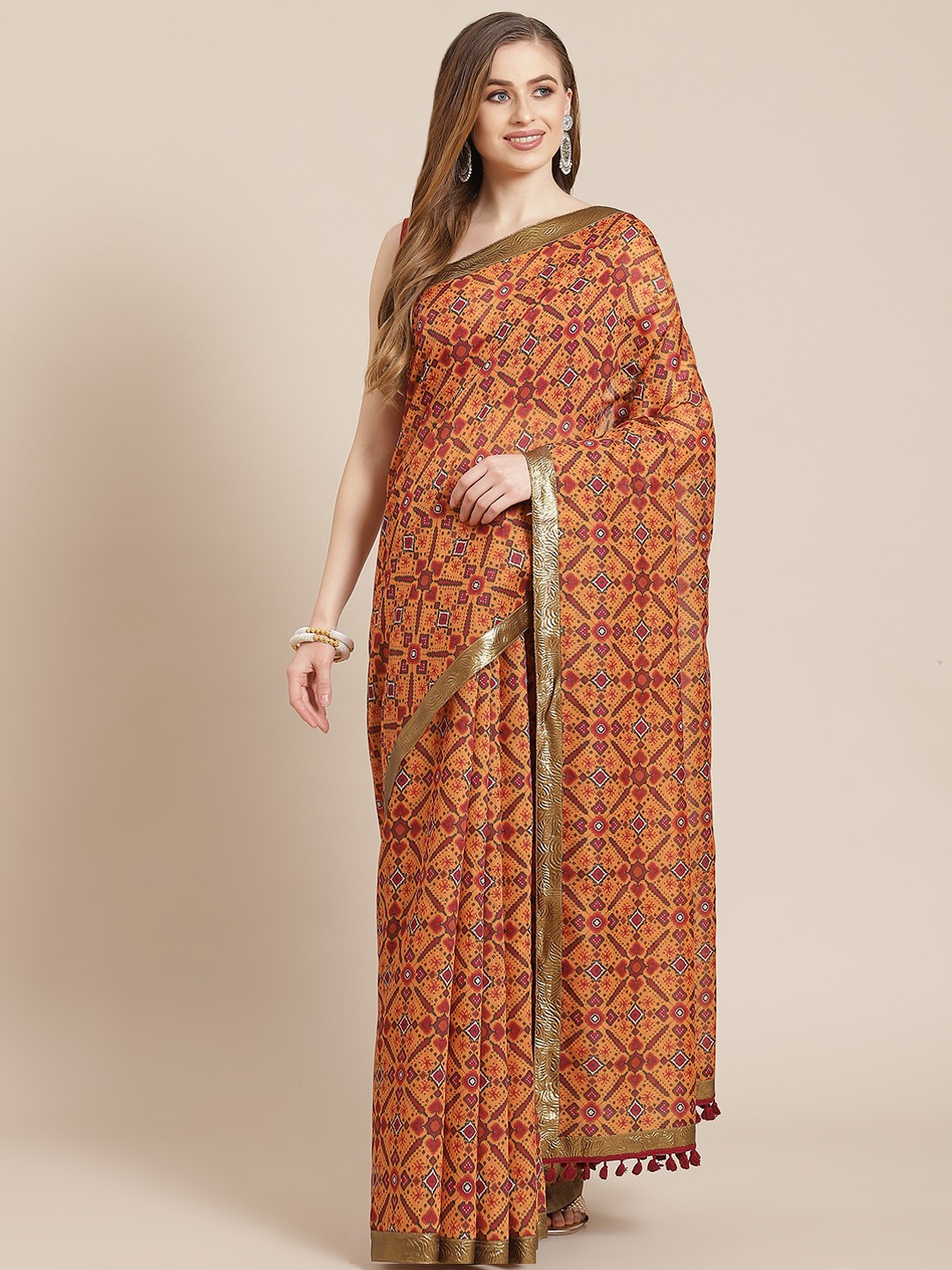 

Shae by SASSAFRAS Mustard Yellow & Green Ethnic Motifs Print Patola Saree
