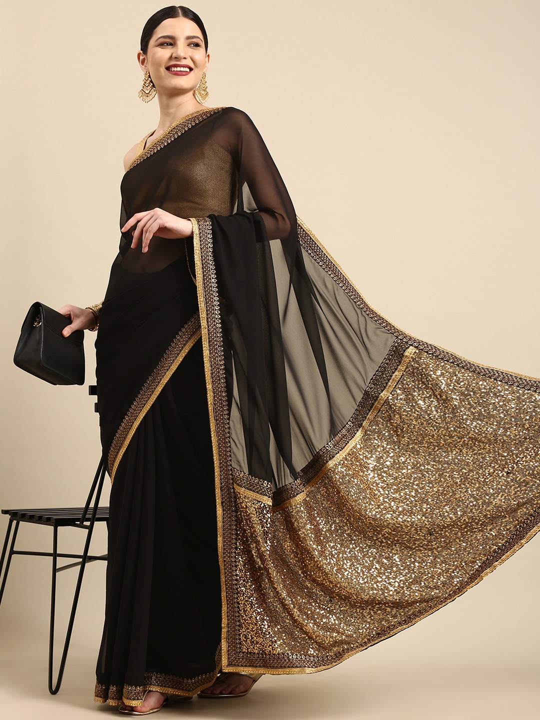 

Anouk Black & Gold Embellished Sequinned Pure Georgette Celebrity Saree