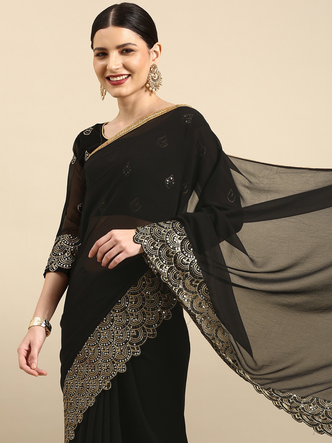 

Anouk Black & Gold Embellished Sequinned Pure Georgette Celebrity Saree