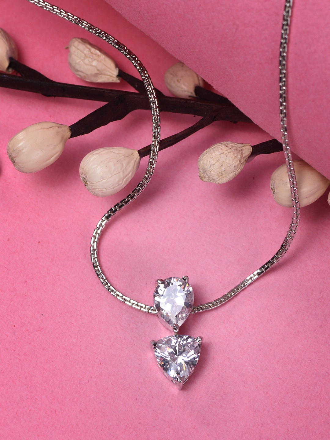 

Saraf RS Jewellery White Rhodium Plated AD Studded Pear Shaped Pendant