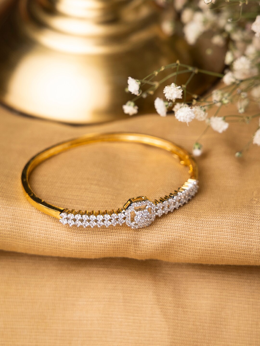 

INDYA Women Gold Plated & White Kundan Studded Bangle Style Bracelet