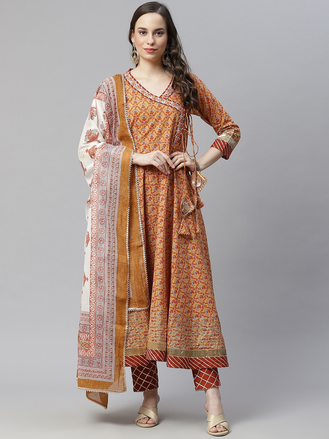 

Nirkhi Women Mustard Yellow Printed Angrakha Pure Cotton Kurti with Trousers & With Dupatta