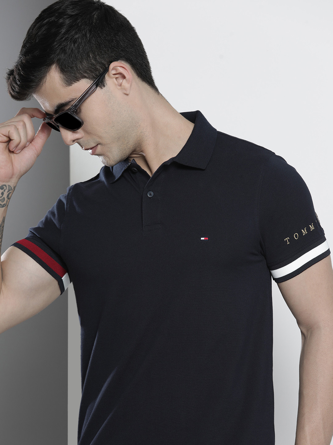 

Tommy Hilfiger Men Navy Blue Brand Logo Printed Polo Collar Slim Fit Casual T-shirt
