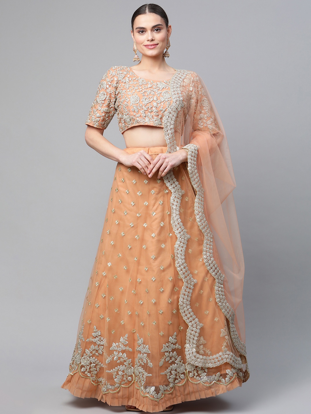 

Readiprint Fashions Peach-Coloured & Gold-Toned Semi-Stitched Lehenga & Unstitched Blouse